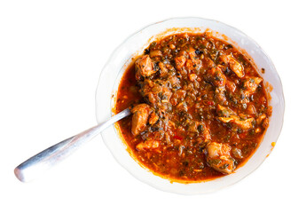 Stewed veal with tomato and herbs, typical Georgian dish Chashushuli. Isolated over white background