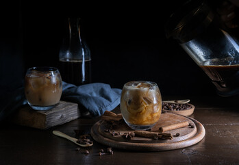 Coffe with milk in glasses and spices