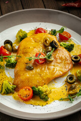 Closeup on cooked chicken fillet in cream cheese sauce