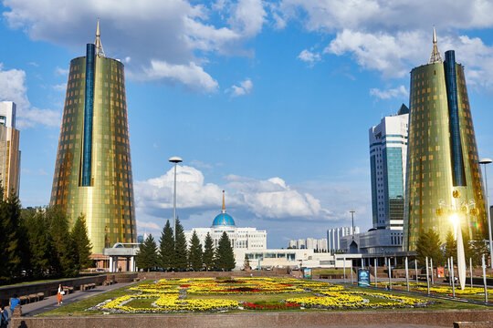 Nur-Sultan, Kazakhstan - July 29, 2021: presidential residence, flower bed and cloudy sky