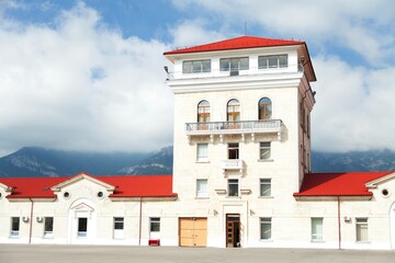 Large White House with a Red Roof