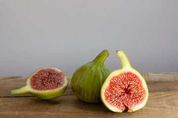 fresh figs sliced on wooden table