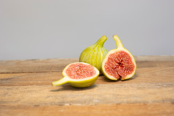 fresh figs sliced on wooden table