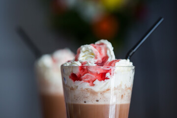 Strawberry and chocolate frappe iced coffee drink with cream and straw