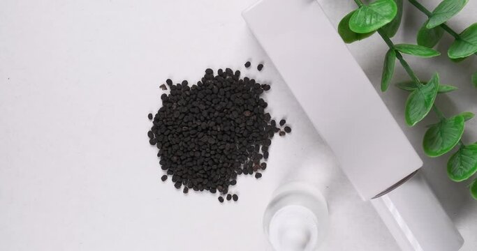 Skincare products with bakuchiol seeds on white background. 