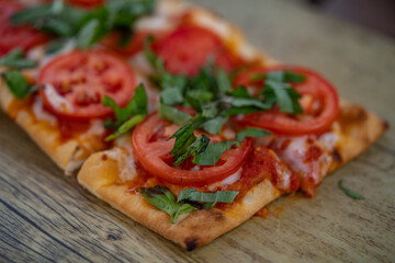 Blurred Margarita flatbreads (Margherita Pizza). Close up view.