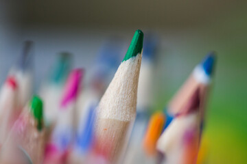 Abstract close up of a group of colored artist pencils 