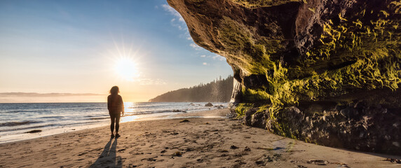 Adventurous Woman at Mystic Beach on the West Coast of Pacific Ocean. Summer Sunny Sunset. Canadian...