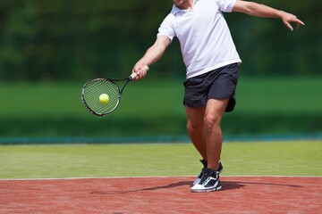 Fototapeta na wymiar Man Playing Tennis
