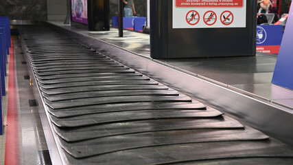 Empty suitcase or luggage with conveyor belt at the airport. 