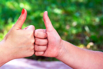 hand showing thumbs up sign.  sign a finger in top. Good work. Everything is ok. Everything is...