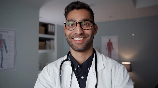 Mixed race male doctor standing in office wearing stethoscope 