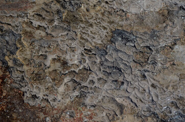 Pamukkale travertine texture. Wavy limestone textured deposits on terraces of carbonate minerals in Pamukkale, Turkey.