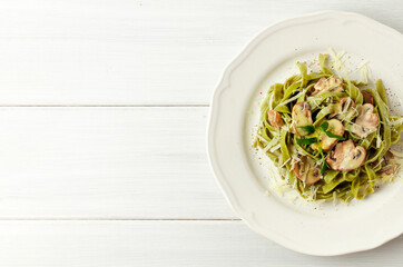 Tagliatelle with spinach and mushrooms, mushrooms, in cream sauce, healthy food, vegetarian dish, top view, horizontal, no people,