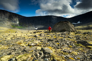 A man looks at the high mountains outdoor