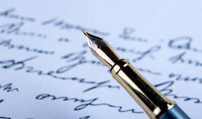 fountain pen on paper with ink text on the paper