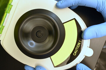 Close-up aerial view of laboratory centrifuge in motion