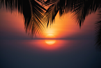 Silhouette of beautiful sunset on the sea beach with palm tree for travel in holiday