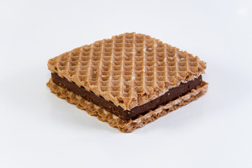square wafer with chocolate filling on white background