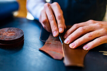 creating process of the leather things in the handmade workshop - obrazy, fototapety, plakaty