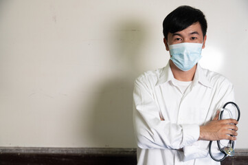 Cheerful mature doctor posing and smiling at camera, healthcare and medicine