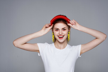 girl in a red cap yellow earrings lifestyle accessories summer style