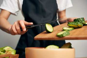 Obraz na płótnie Canvas slicing food for salad ingredients fresh vegetables cooking