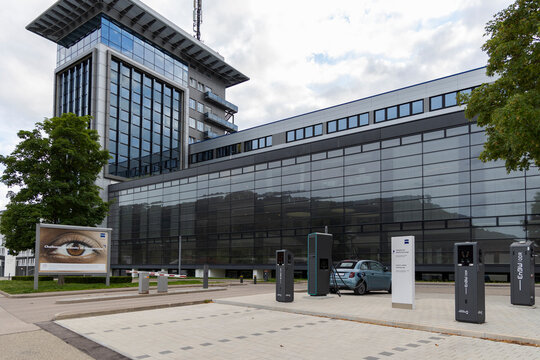 Oberkochen, Germany Bavaria 08-16-2021 : Fiat 500e Icon Convertible charging the batteries at an ENBW Quick-Charger in front of the forum building of the Zeiss company.