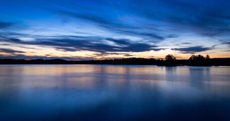 Fototapeta na wymiar Midnight panorama landscape on Swedish lake