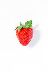 Bright red strawberry isolated on a white background