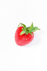 Bright red strawberry isolated on a white background