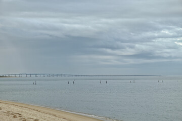 The Chesapeake Bay entrance on a cloudy day with the Bay-Tunnel bridge off in the distance