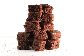 Extream close up shot of stack homemade chocolate brownies cracker, Pieces of fresh brownie on white background. Delicious chocolate pie.