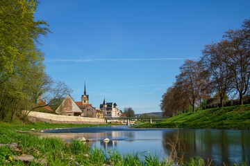 medieval castle by the river in a small European town