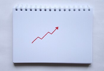 Photo of a drawing of a red arrow pointing up