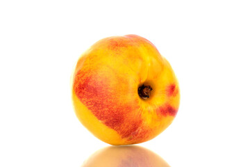 One juicy ripe nectarine, close-up, isolated on white.