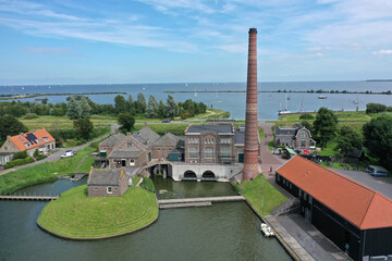 Drone aerial view of Stoomgemaal Vier Noorder Koggen, which has housed the Dutch Steam Engine Museum since 1985, is a steam pumping station, the first part of which was completed in 1869, located on t