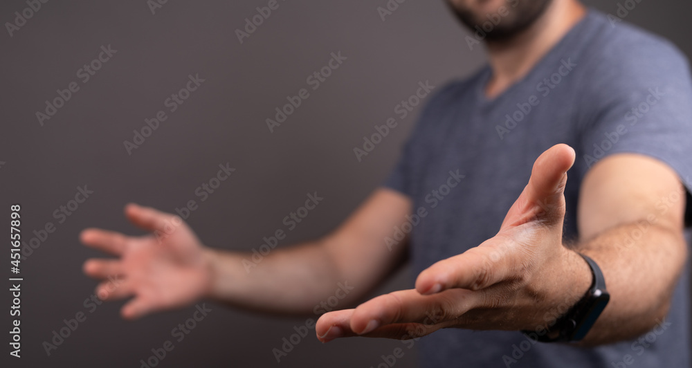Poster man showing his empty hand.