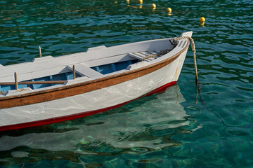 wooden fisherman small boat on the sea