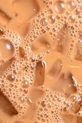Close up of iced coffee with cream and bubbles