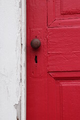 Old Weathered Door, Red, White Wall With Peeling Pai