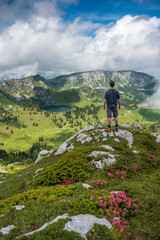 hiker enjoying an epic view of Diemtigtal with Seebergsee in the Bernese Alps