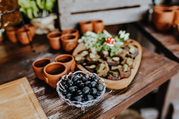 Beautifully decorated snacks on the banquet table before the holiday. Catering food and drink on wedding party
