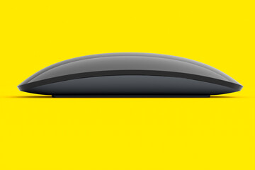 Realistic black wireless computer mouse with touch isolated on yellow background
