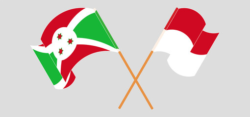 Crossed and waving flags of Burundi and Monaco