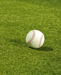 Baseball on neatly mowed grass