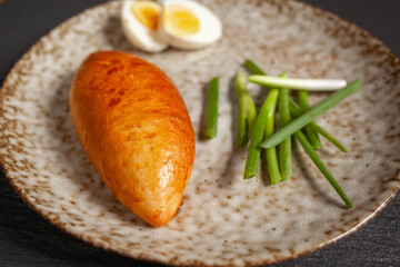 Pies. Bakery. Homemade food. Delicious food for lunch. On a plate are pastries with egg and onions.