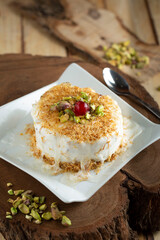 kunafa ice cream with nuts on the plate