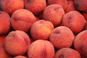 Organic peaches  on the market. Background, food texture, new harvest.