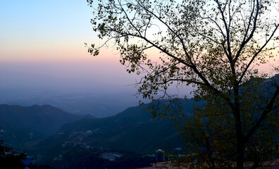 A picture of the Scenic beauty of the Valley, Mountains, and trees, from a high point in Mussoorie, Uttarakhand.